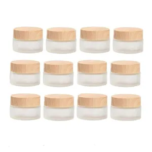 12 Packs 1 Oz Empty Jars 30ml Round Frosted Glass Cream Jar Bottles Holder with Wood Grain Lids Refillable Case Vial Pot Cosmetic Container Glass Bottles for Lotion Face Lip Balm Eye Cream